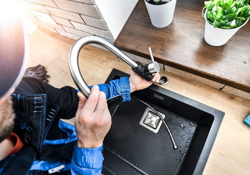Plumber,Repair,Water,Tap,In,Kitchen,,Close,Up,Of,Hands Plumber,Repair,Water,Tap,In,Kitchen,,Close,Up,Of,Hands